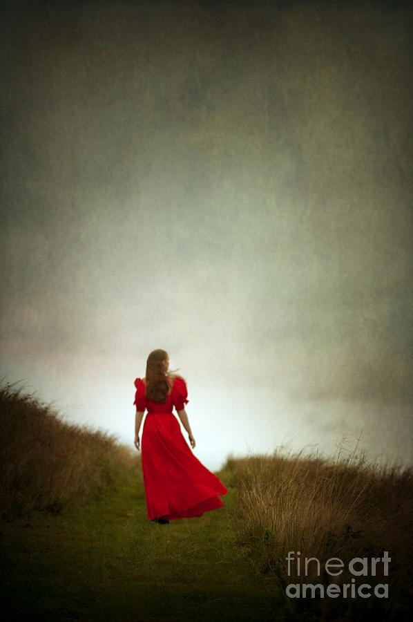 Woman In A Vintage Red Dress Walking On Moorland Photograph by Lee Avison
