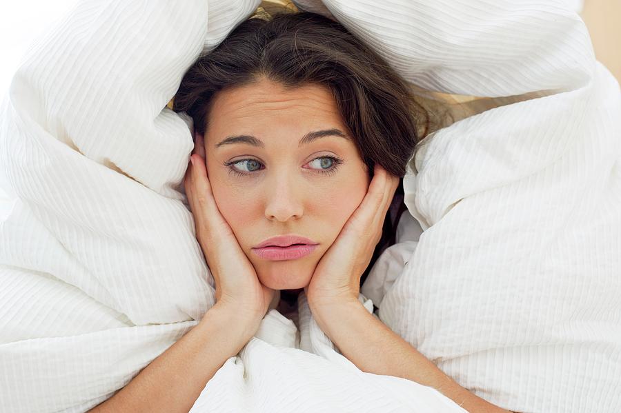 Woman In Bed With Hands On Chin Photograph By Ian Hooton - Pixels