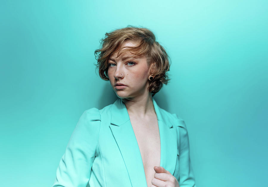 Woman In Blue Jacket On Blue Background Photograph by Ian Ross Pettigrew
