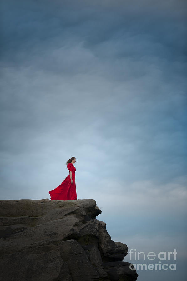 Woman In Red Dress On A Clifftop Photograph by Lee Avison