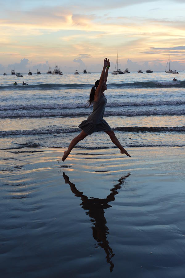 Woman Jumping  Dancing In The Sunset On Photograph by Volanthevist