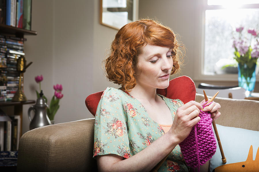Woman knitting in livingroom. Photograph by Betsie Van Der Meer
