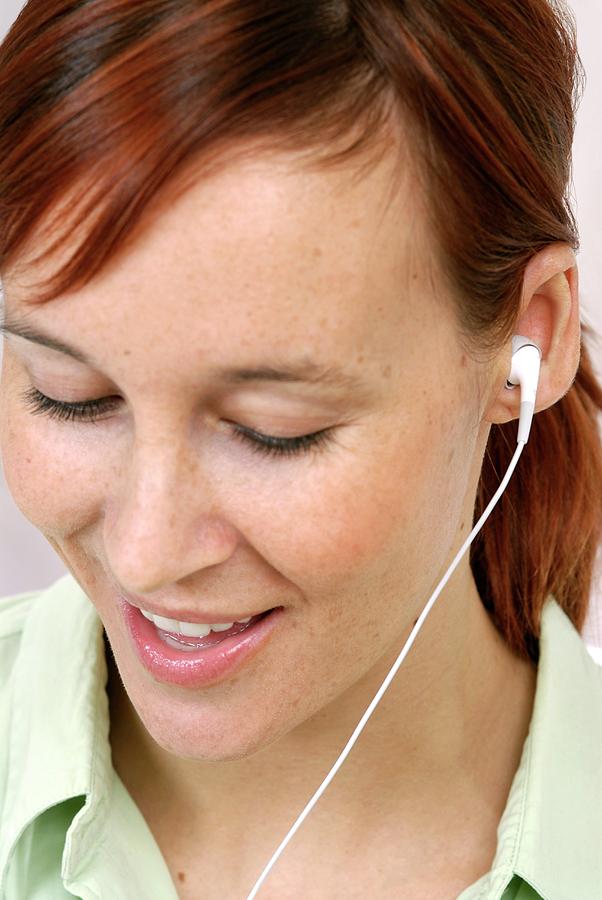 Woman Listening To Music Photograph by Lea Paterson/science Photo Library