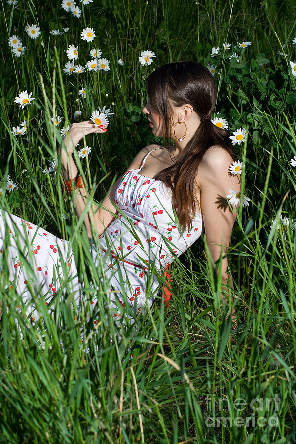 Daisy Photograph - Woman looking at daisy by Diana Jo Marmont