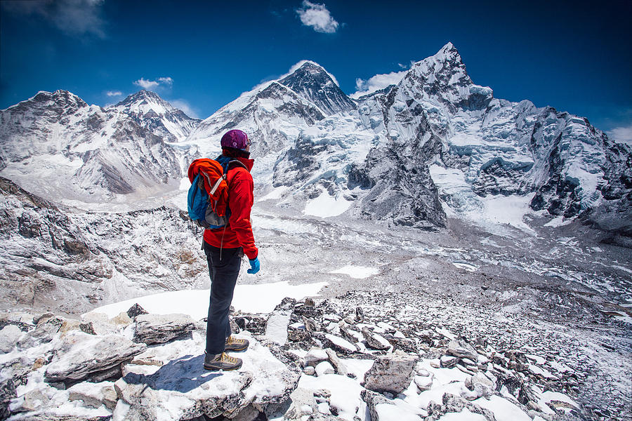 Woman looking at view on Himalayas Photograph by Miljko