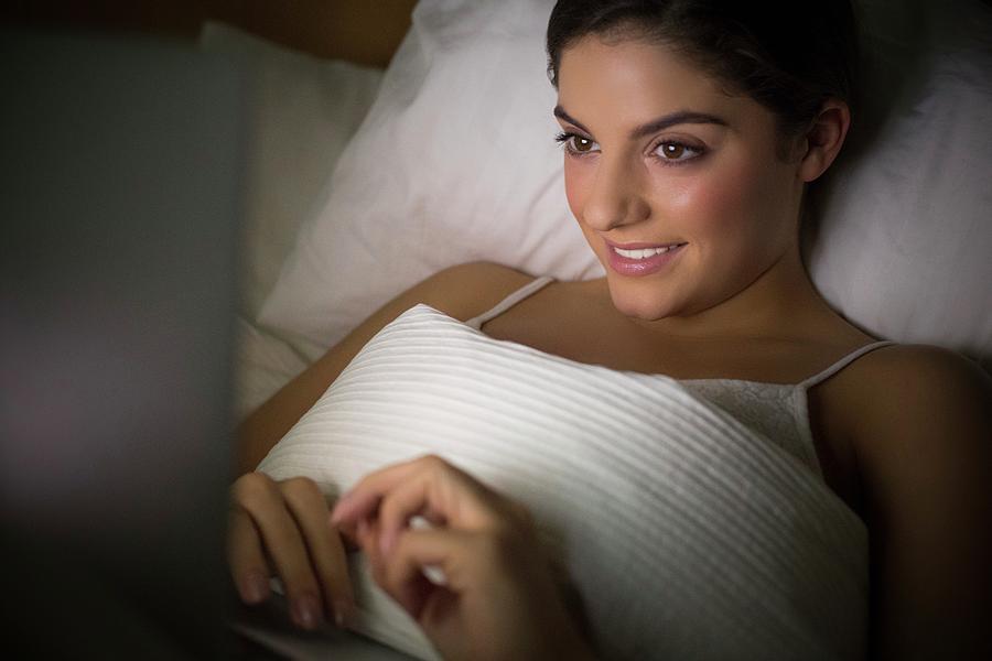 Woman Lying In Bed Watching Laptop Photograph By Ian Hootonscience Photo Library