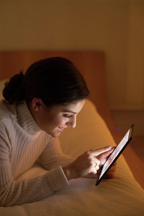 Woman Lying On Bed With Digital Tablet Photograph By Ian Hootonscience Photo Library Fine Art