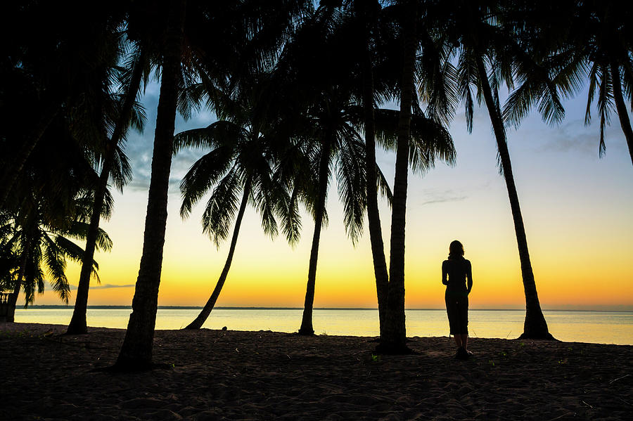Woman On A Carribean Beach Watching Photograph by Spooh