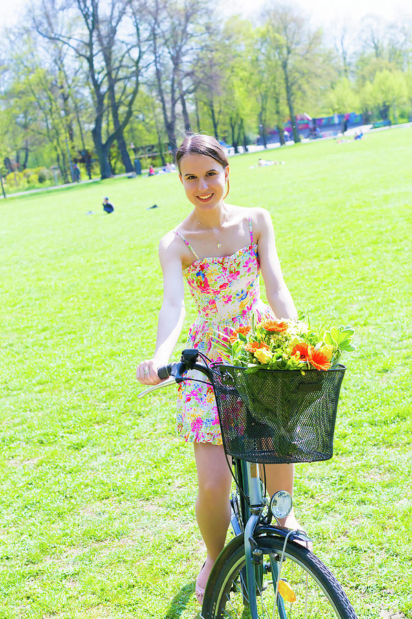 Woman On Bicycle In A Park In Summer Photograph by Wladimir Bulgar/science Photo Library