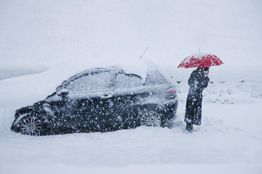 Woman On Mobile Alongside Car In A Snow Drift Photograph by Andrew Bret Wallis