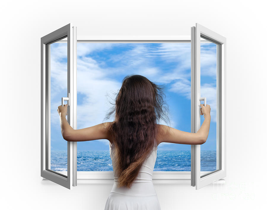 woman-opening-window-with-view-on-sea-oleksiy-maksymenko.jpg
