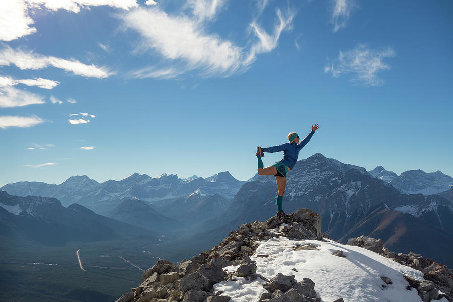 Woman Performs Yoga Move On Mountain Photograph by Ascent Xmedia