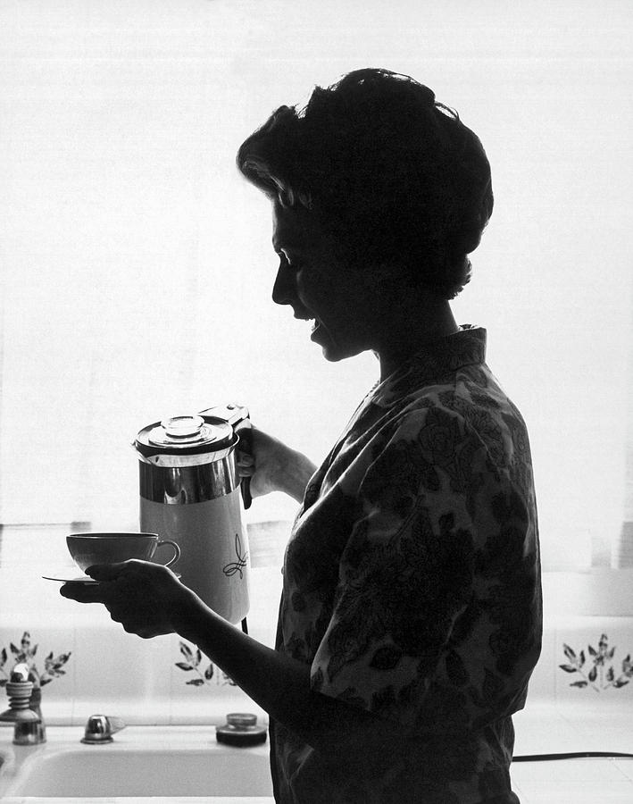 Woman Pouring Coffee Photograph by Underwood Archives