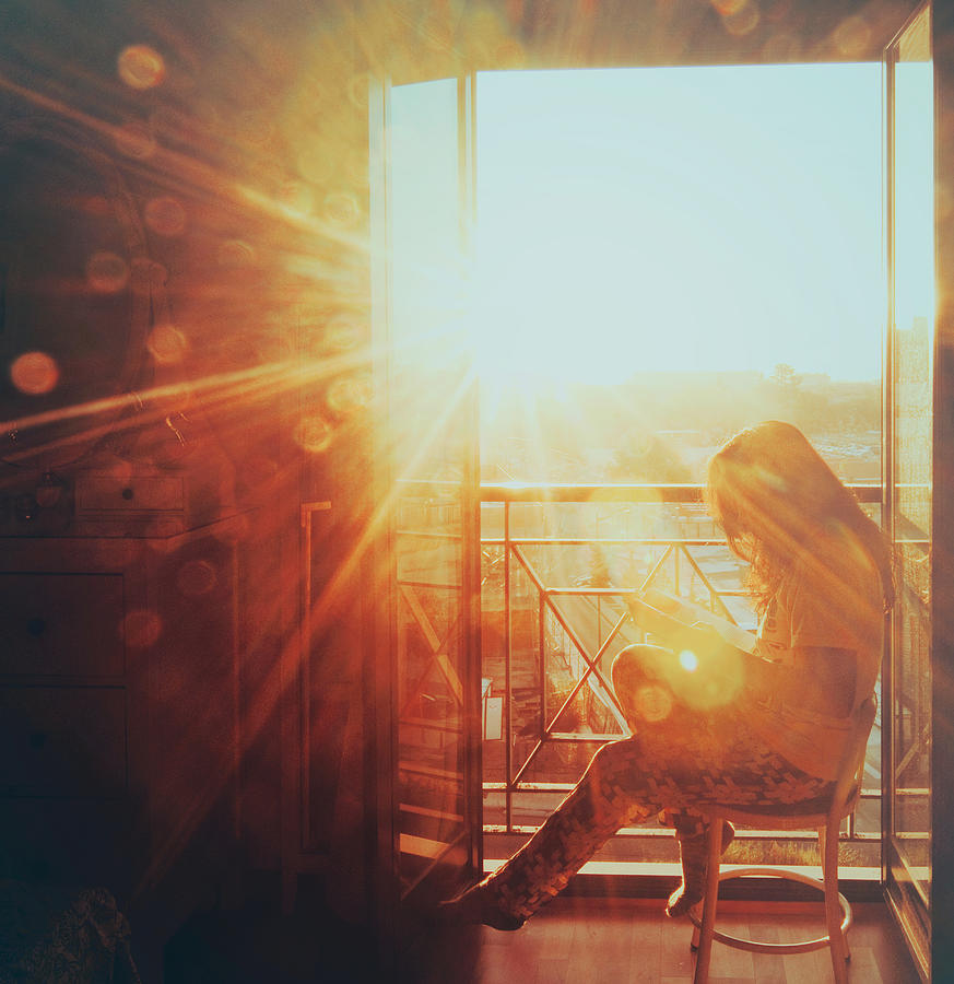 Woman reading in the morning sun Photograph by Julia Davila-Lampe