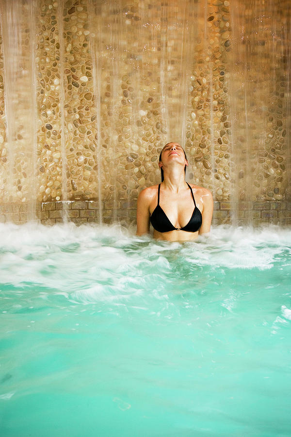 Waterfall Photograph - Woman Relaxing At A Spa In The Hot Tub by Corey Hendrickson