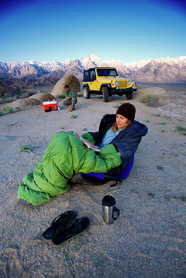Mountain Photograph - Woman Relaxing In A Sleeping Bag by Corey Rich