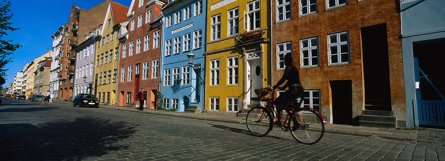 Architecture Photograph - Woman Riding A Bicycle, Copenhagen by Panoramic Images