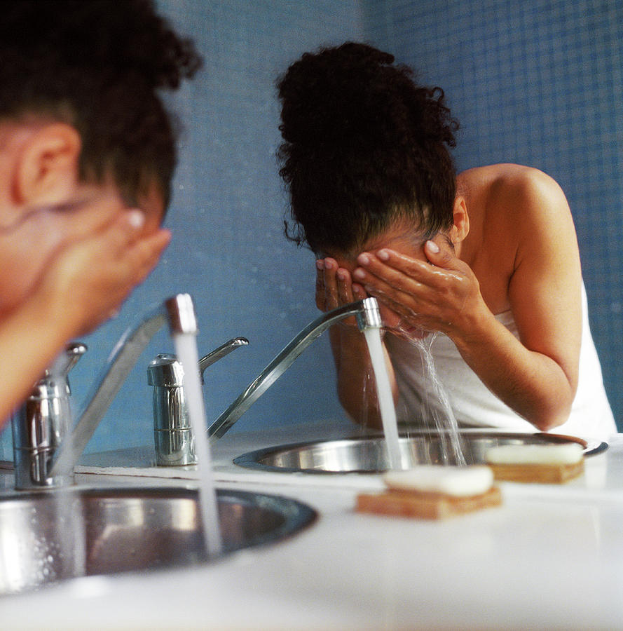 Woman Rinsing Her Face Photograph by Cristina Pedrazzini/science Photo Library