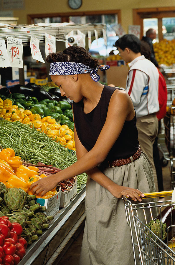Woman Shopping for Vegetables Photograph by Doug Menuez / Forrester Images