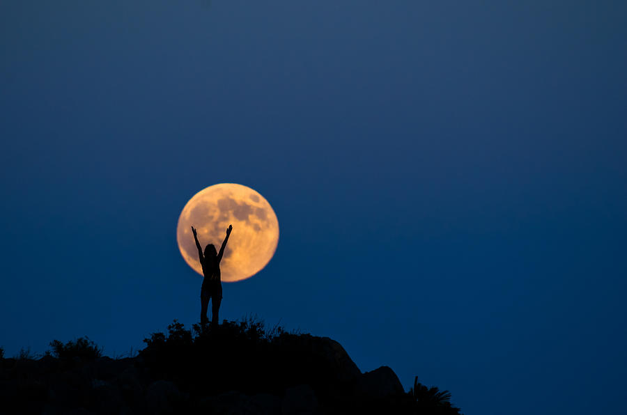Woman silhouette on the full moon Photograph by Manuel Breva Colmeiro