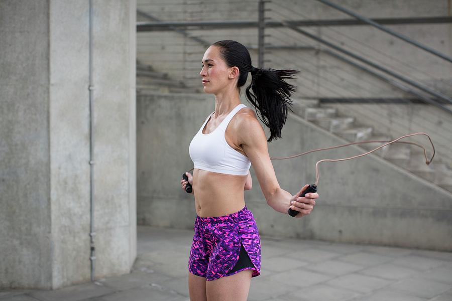 Woman Skipping With Rope Photograph by Science Photo Library