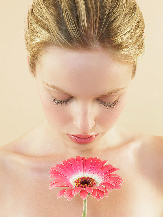Woman Smelling A Flower Photograph by Kate Jacobs/science Photo Library
