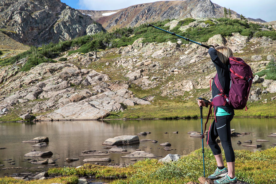 Nature Photograph - Woman Standing By An Alpine Lake by Alexandra Simone