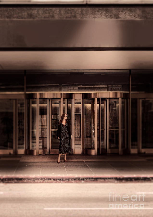 Architecture Photograph - Woman Standing by Revolving Doors by Jill Battaglia