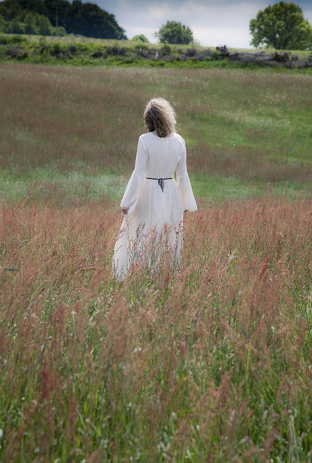 Elf Photograph - Woman stands on a meadow by Maria Heyens