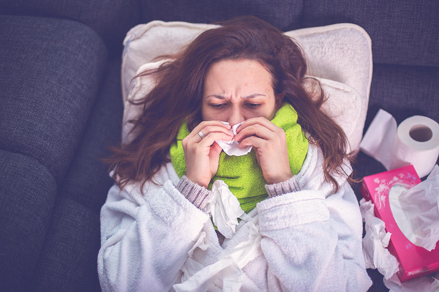 Woman suffering from influenza Photograph by South_agency