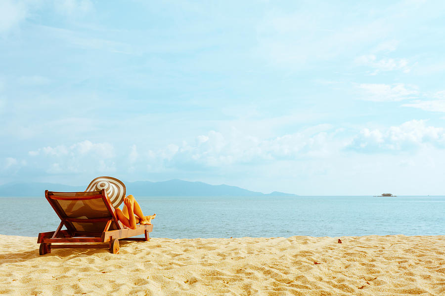 Woman Sunbathing In Beach Chair Photograph by VladGans