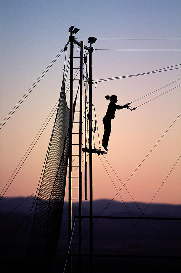 Mountain Photograph - Woman Swinging On A Trapeze At Sunset by Corey Rich