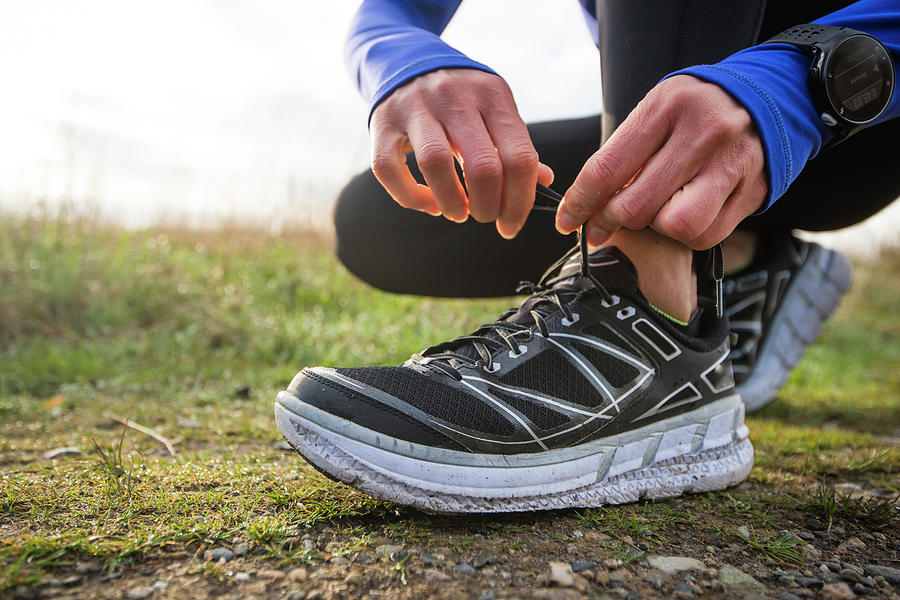 Woman Tying Her Shoe For A Trail Run Photograph by Cate Brown - Fine ...