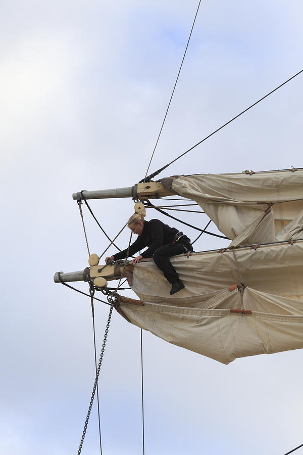 Woman unfastening sails Photograph by Ulrich Kunst And Bettina Scheidulin
