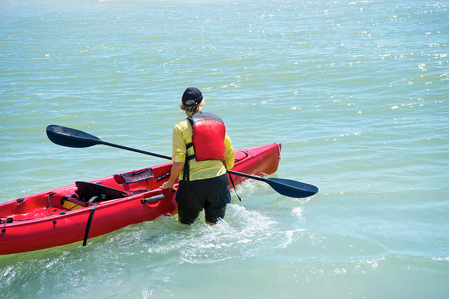 Woman Wading In Water With A Kayak Photograph by Leslie Parrott - Fine ...