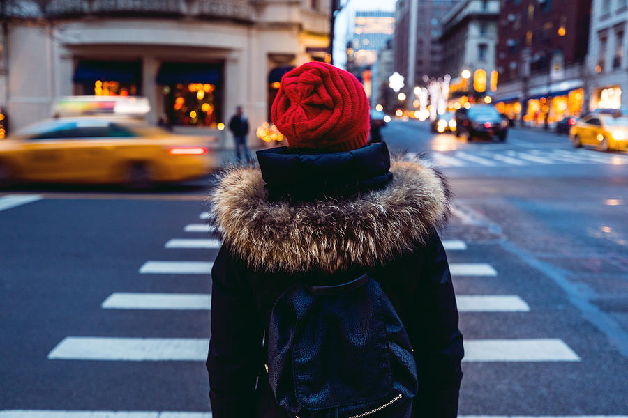 Woman waiting to cross the street in downtown Manhattan - New York City Photograph by LeoPatrizi