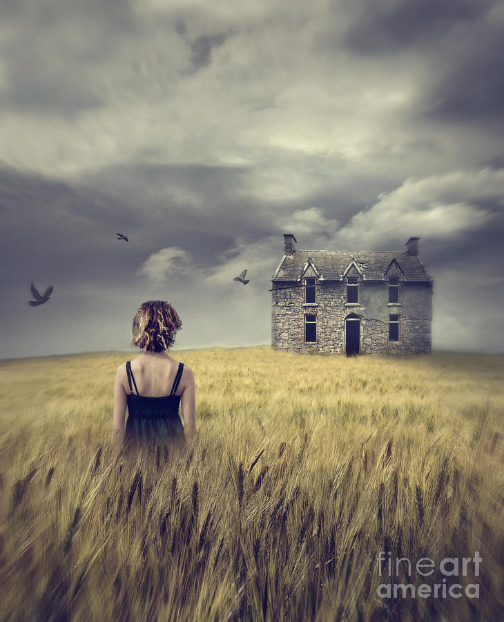 Woman walking in wheat field with abandoned house in background Photograph by Sandra Cunningham