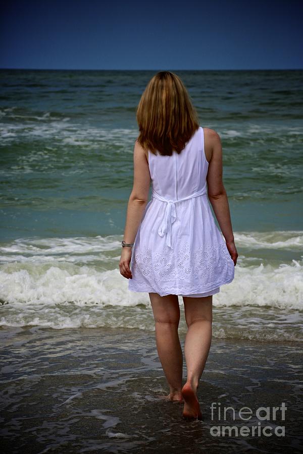 Woman Walking On The Beach Photograph