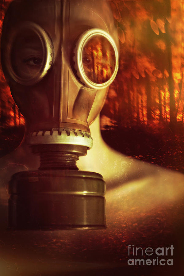 Woman waring a gas mask with fires raging in background Photograph by Sandra Cunningham