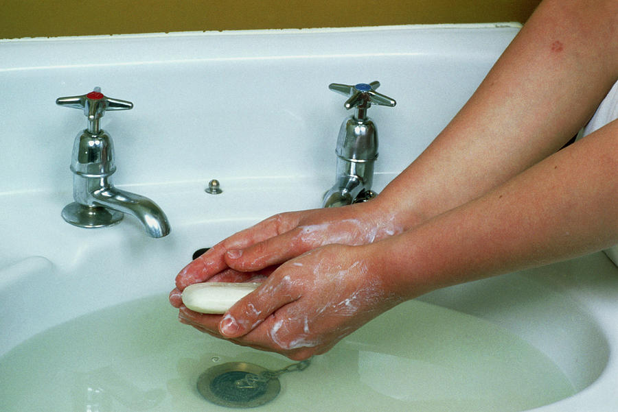 Woman Washes Hands At Sink Using Soap And Water Photograph by Garry Watson/science Photo Library