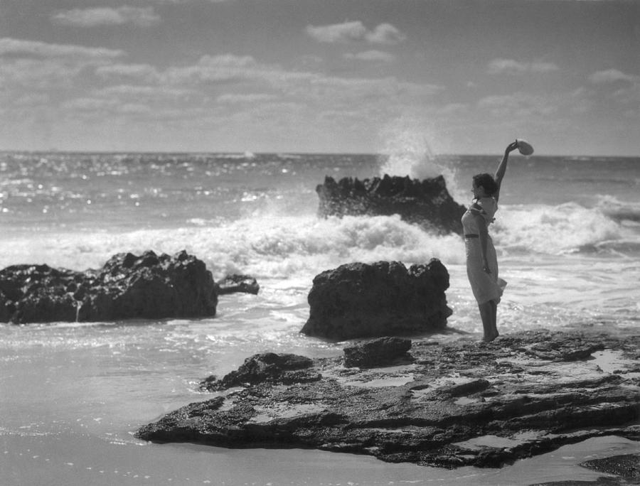 Woman Waving On Shore Photograph by Underwood Archives