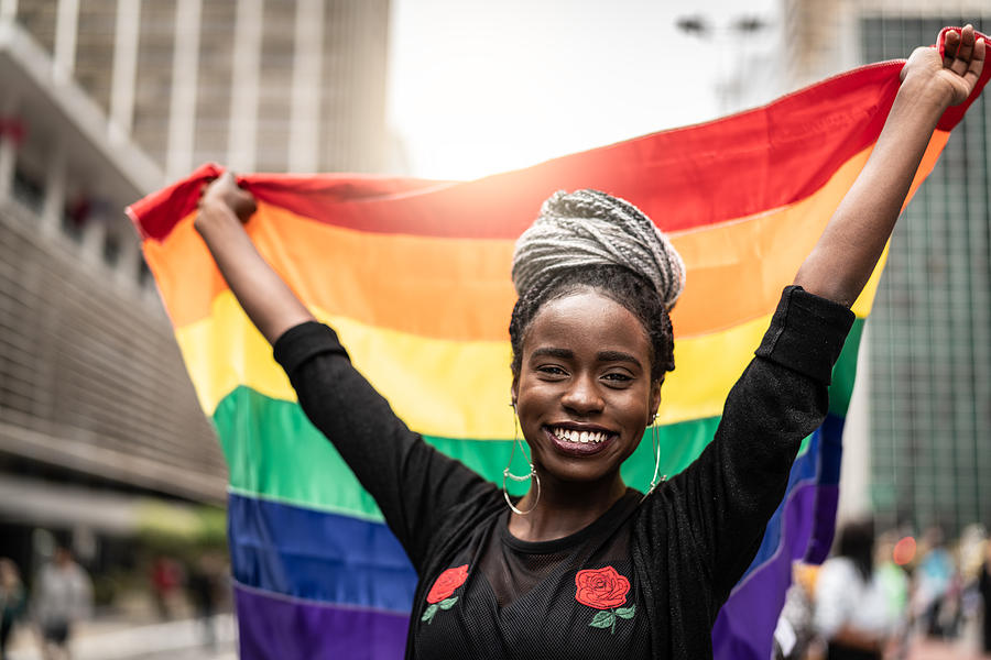 Woman Waving Rainbow Flag at Gay Parade Photograph by FG Trade