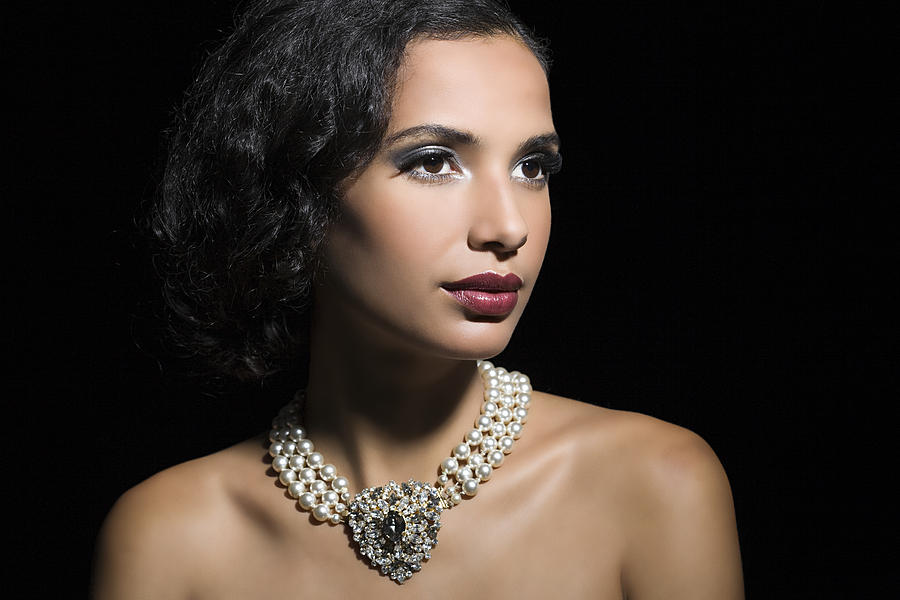 Woman wearing a pearl necklace Photograph by Image Source