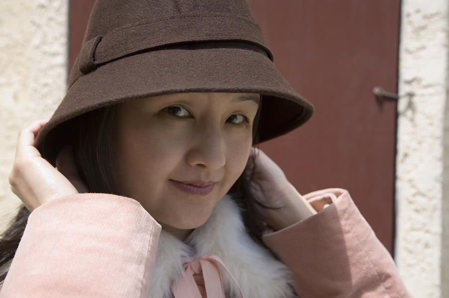 Woman wearing hat and pink coat Photograph by Holly Harris