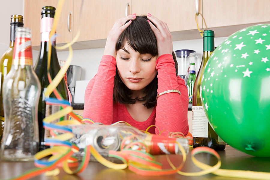 Woman with a hangover after a party Photograph by Image Source