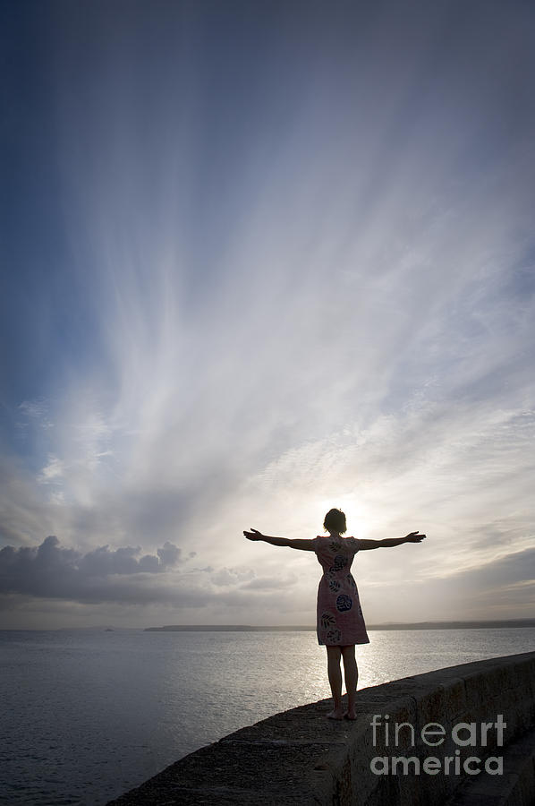 Woman With Arms Outstretched By The Ocean Photograph by Lee Avison