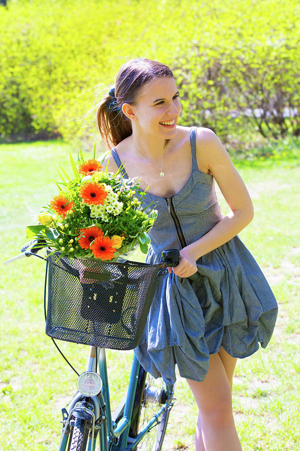 Summer Photograph - Woman With Bicycle And Basket Of Flowers by Wladimir Bulgar/science Photo Library