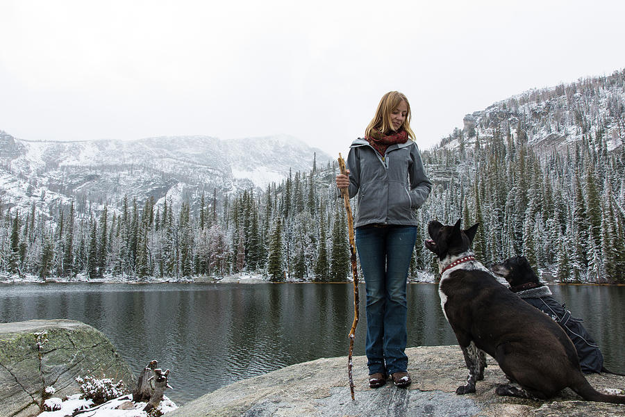 Nature Photograph - Woman With Dogs Hiking Near Lake by Cameron MacPhail