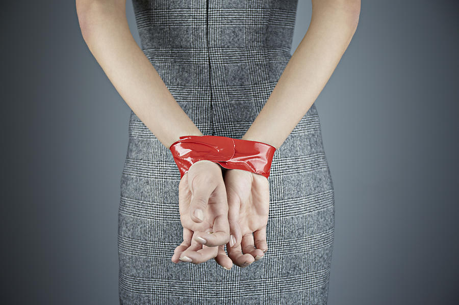 Woman with hands tied behind back Photograph by Compassionate Eye Foundation