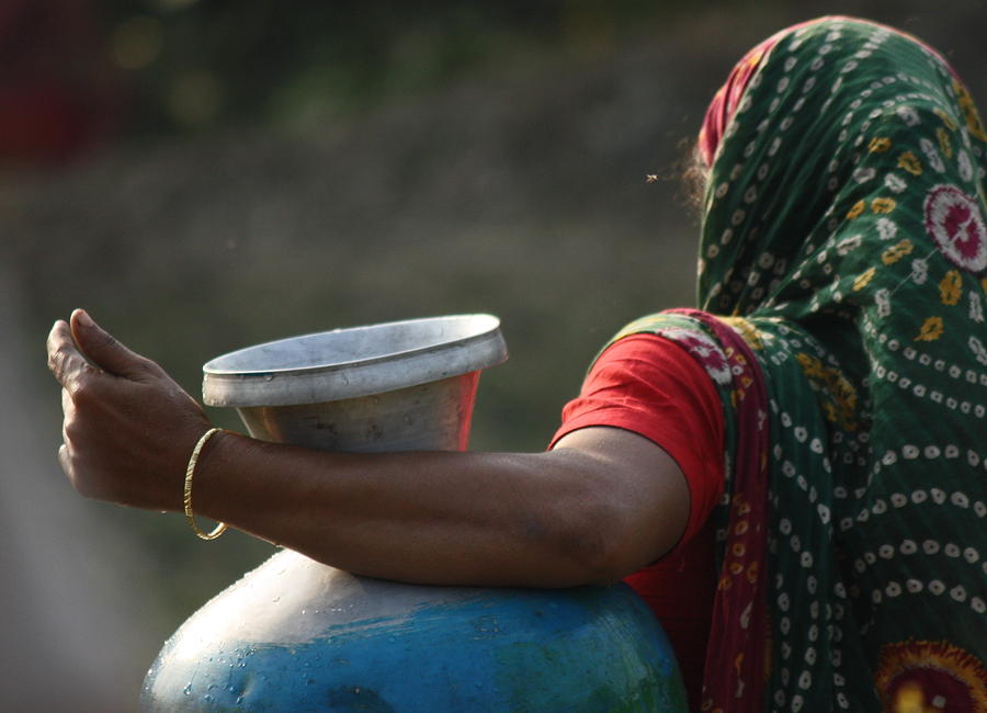 Woman with pot Photograph by Bristy M. Rahman